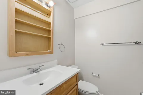 a bathroom with a sink toilet and vanity