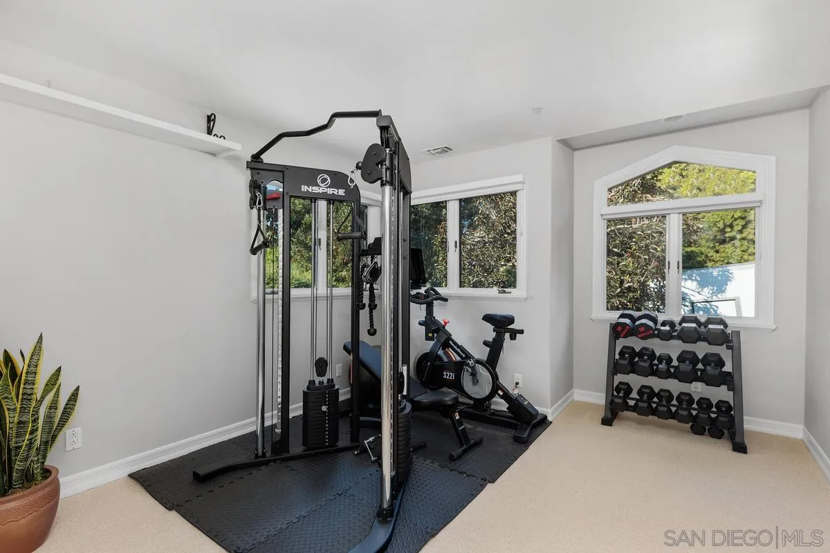 390 East Glaucus Street Encinitas, CA 92024 - Photo 16 of 25 a bedroom with furniture and a window