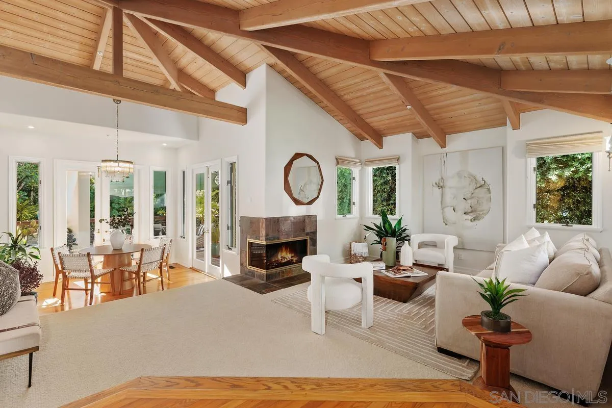 390 East Glaucus Street Encinitas, CA 92024 - Photo 5 of 25 a living room with furniture a large window and wooden floor