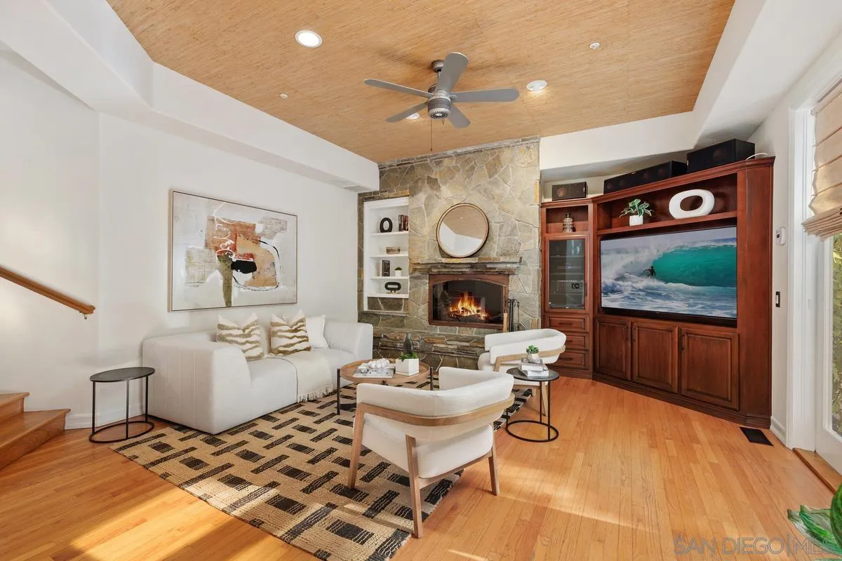 390 East Glaucus Street Encinitas, CA 92024 - Photo 8 of 25 a living room with furniture and a clock
