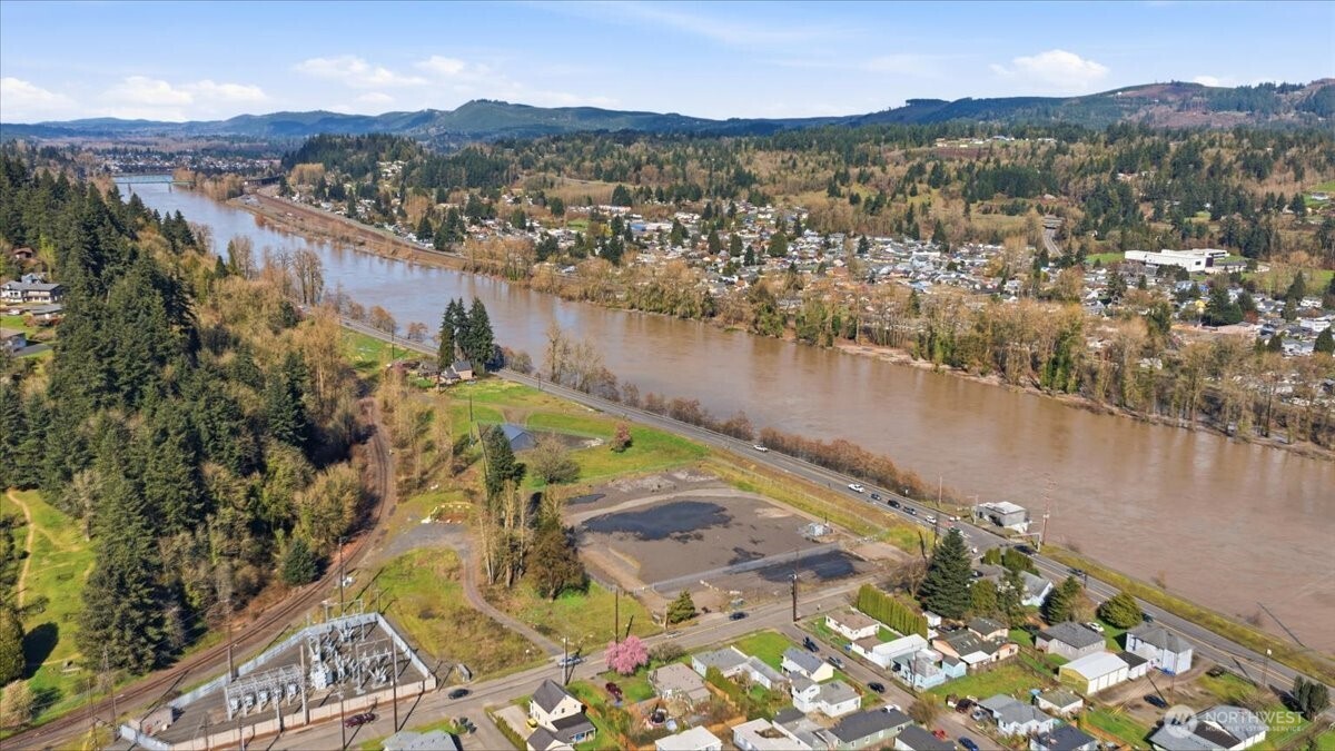 an aerial view of a house with a lake view