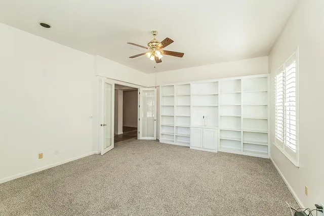 a large kitchen with stainless steel appliances granite countertop a sink stove and refrigerator