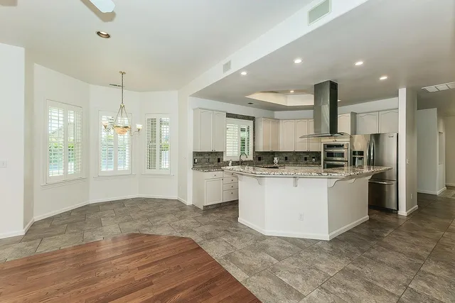 a view of a room with closet and ceiling fan