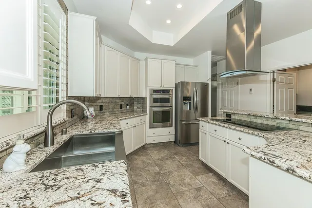 a bathroom with a glass shower door and a bathtub