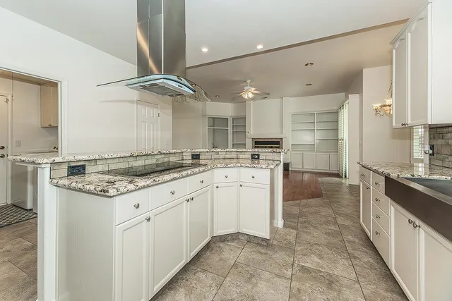 a view of an empty room with a fireplace