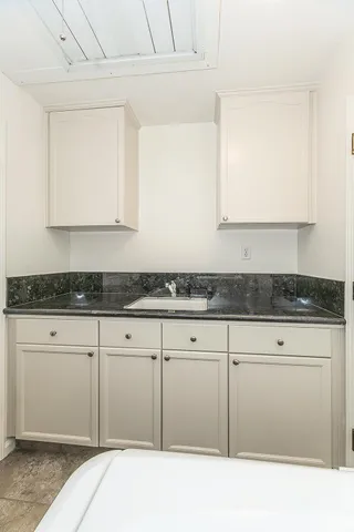 an empty room with a ceiling fan