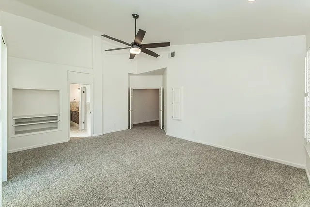 a spacious bathroom with a granite countertop sink a mirror and a