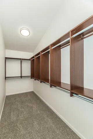 a porch with a table and chairs