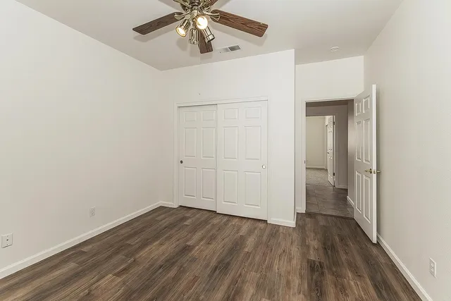 a view of a house with floor to ceiling windows and a basket ball poll