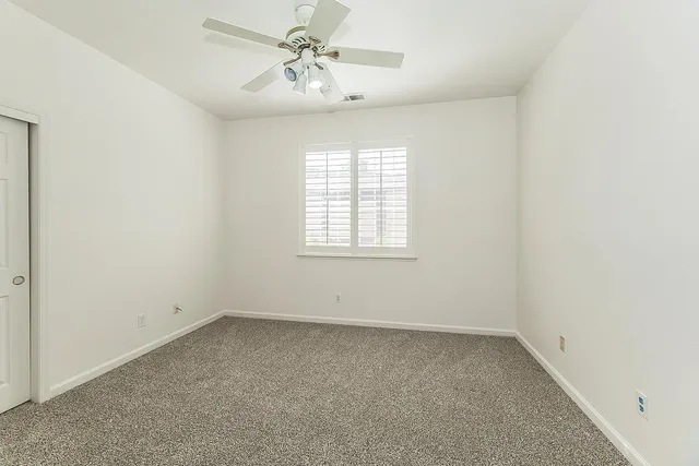 a view of a lake with a house in the background