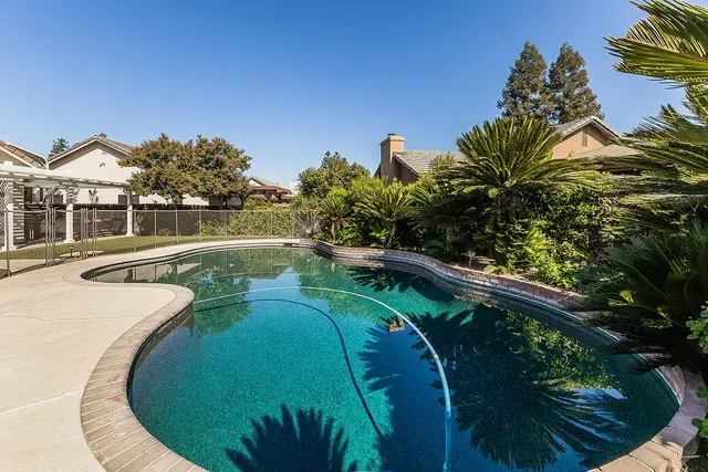 a view of a small house with a roof deck