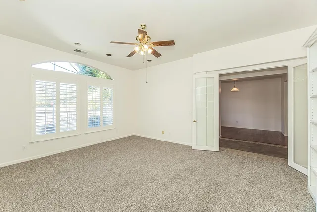 a large kitchen with stainless steel appliances kitchen island granite countertop a sink stove and refrigerator