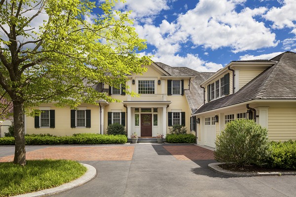 front view of a house with a garden