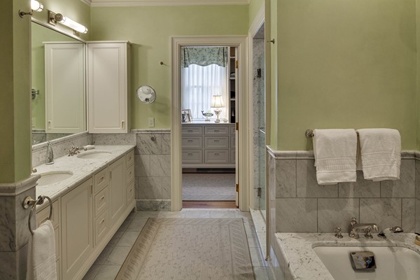 55 Estabrook Road Concord, MA 01742 - Photo 11 of 18 a bathroom with a granite countertop sink a large mirror and a bathtub