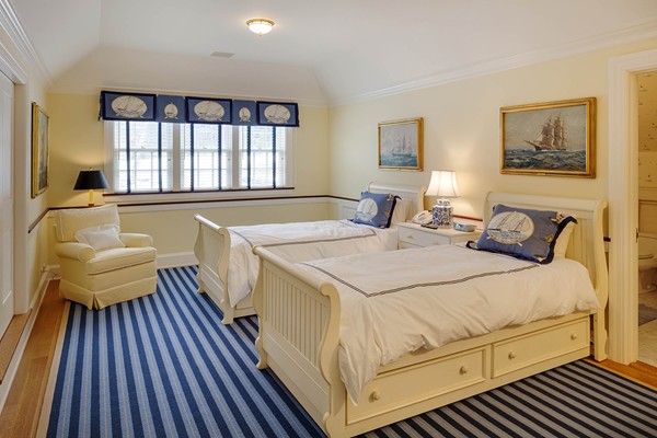 55 Estabrook Road Concord, MA 01742 - Photo 13 of 18 a spacious bedroom with a bed and a couch