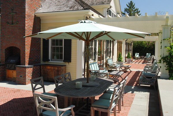 55 Estabrook Road Concord, MA 01742 - Photo 15 of 18 a view of a patio with table and chairs with wooden floor