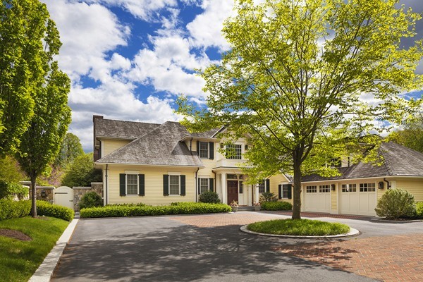 55 Estabrook Road Concord, MA 01742 - Photo 16 of 18 a front view of a house with a garden