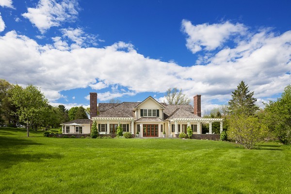 55 Estabrook Road Concord, MA 01742 - Photo 18 of 18 a front view of a house with a garden
