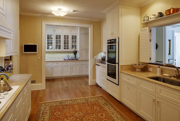 55 Estabrook Road Concord, MA 01742 - Photo 9 of 18 a kitchen with stainless steel appliances granite countertop a sink and dishwasher a stove top oven with wooden floor
