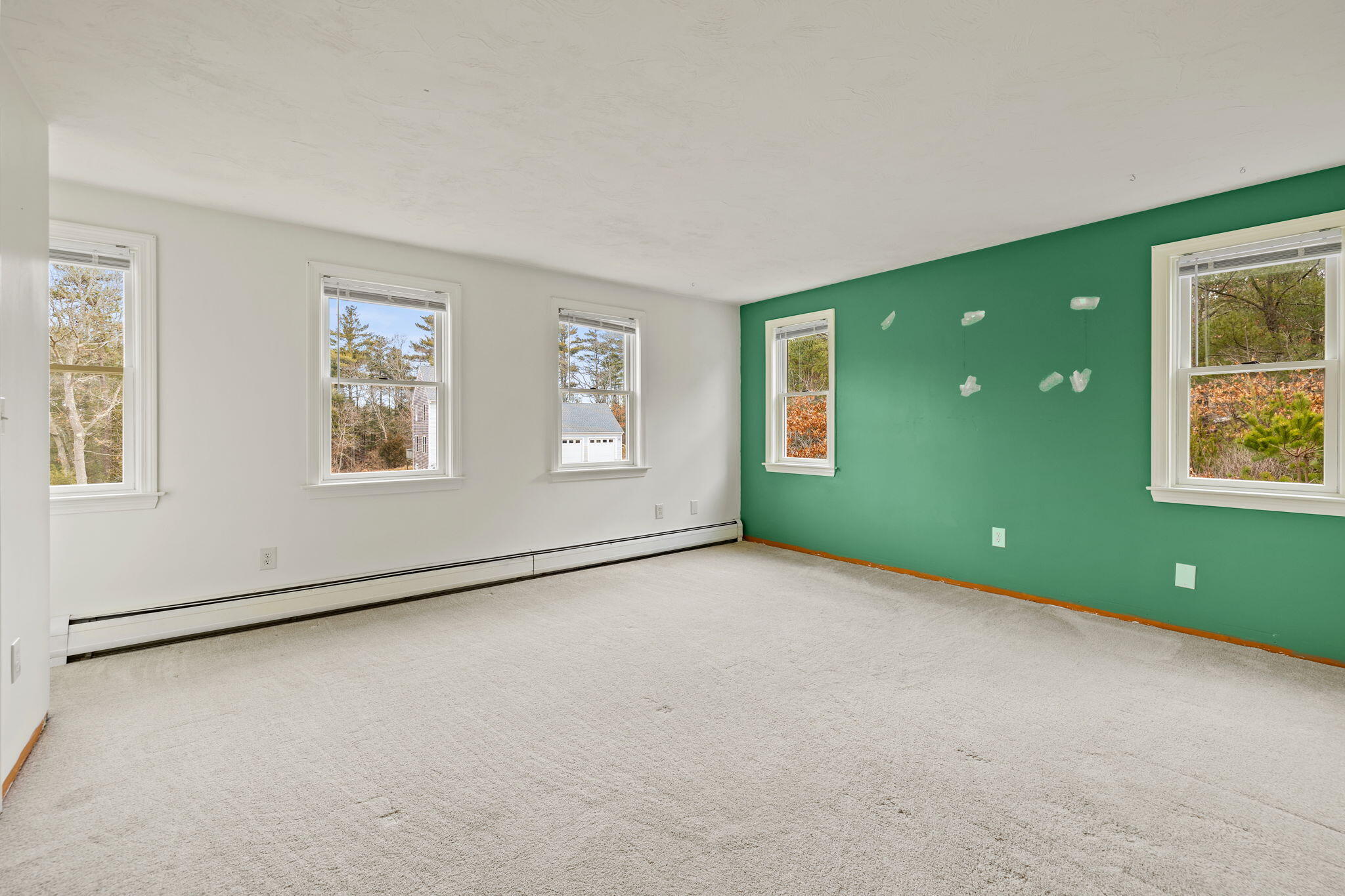 21 Heather Hill Road Buzzards Bay, MA 02532 - Photo 16 of 32 a view of an empty room with a window and a kitchen