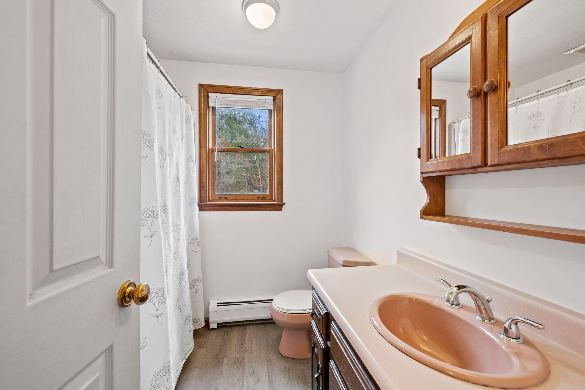 21 Heather Hill Road Buzzards Bay, MA 02532 - Photo 18 of 32 a bathroom with a sink a toilet and shower curtain