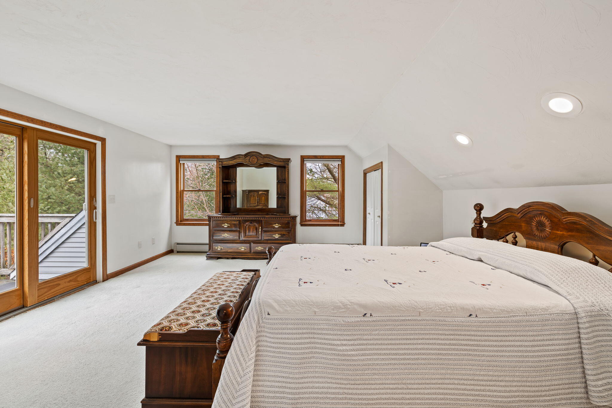 21 Heather Hill Road Buzzards Bay, MA 02532 - Photo 19 of 32 a spacious bedroom with a bed and a flat tv screen on dresser