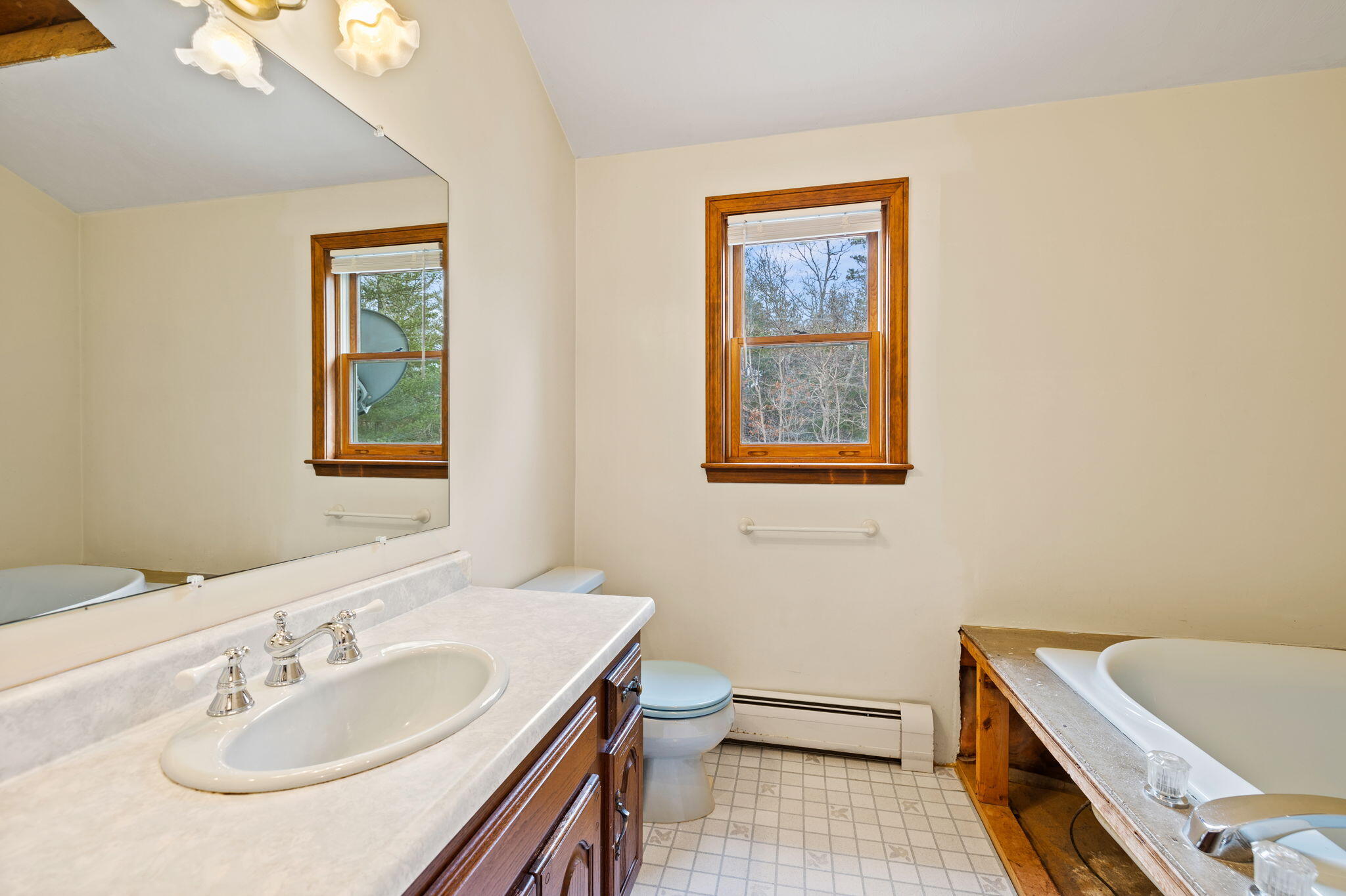 21 Heather Hill Road Buzzards Bay, MA 02532 - Photo 21 of 32 a bathroom with a sink and a mirror