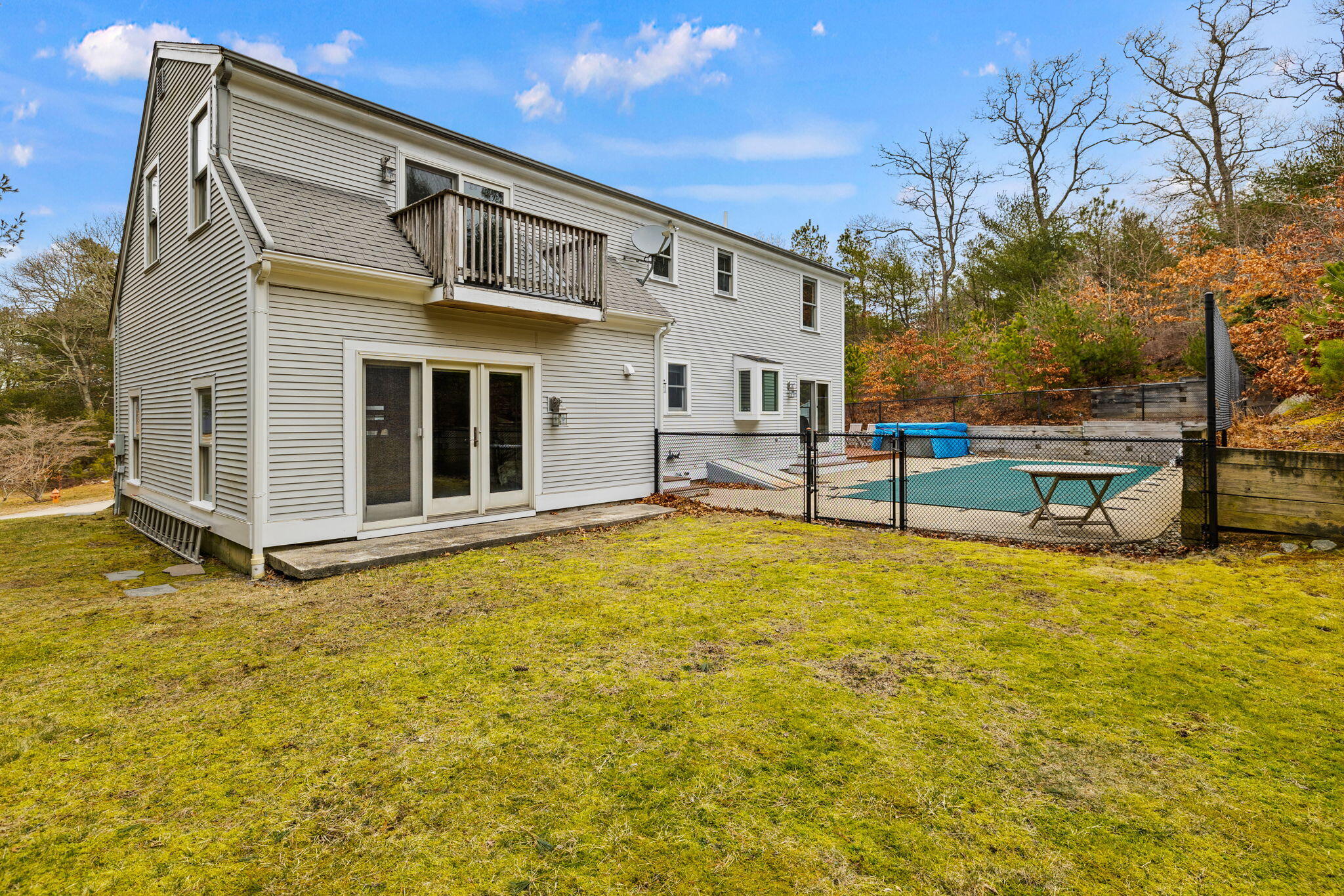 21 Heather Hill Road Buzzards Bay, MA 02532 - Photo 25 of 32 a view of a house with pool and porch