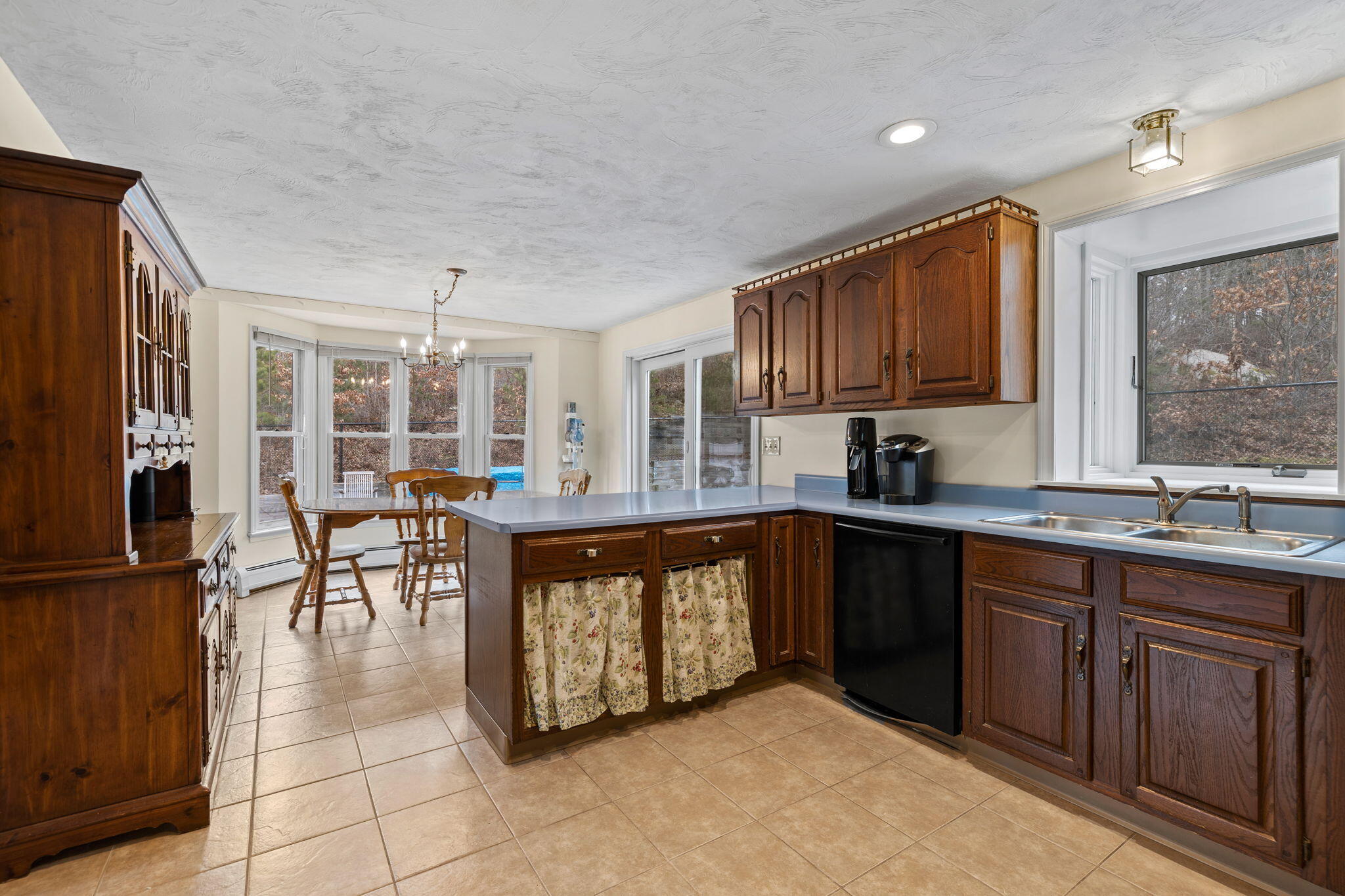 21 Heather Hill Road Buzzards Bay, MA 02532 - Photo 7 of 32 a large kitchen with stainless steel appliances granite countertop a stove and a sink