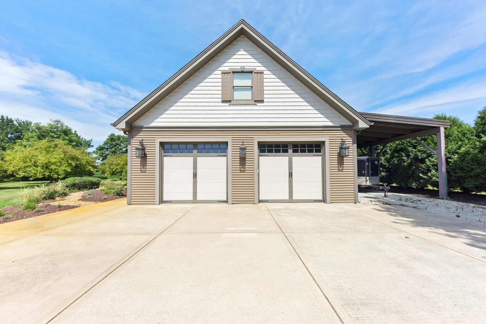Undisclosed Address Manhattan, IL 60442 - Photo 2 of 9 a front view of a house with a yard and garage