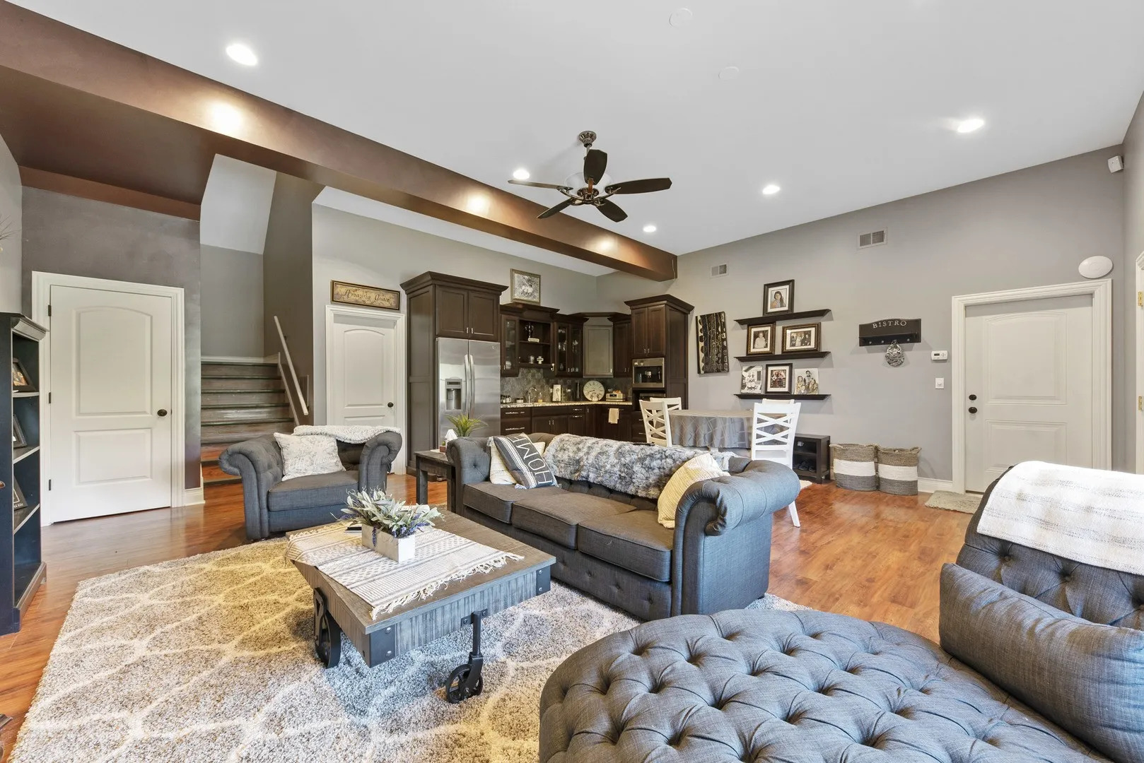 Undisclosed Address Manhattan, IL 60442 - Photo 4 of 9 a living room with furniture ceiling fan and a rug