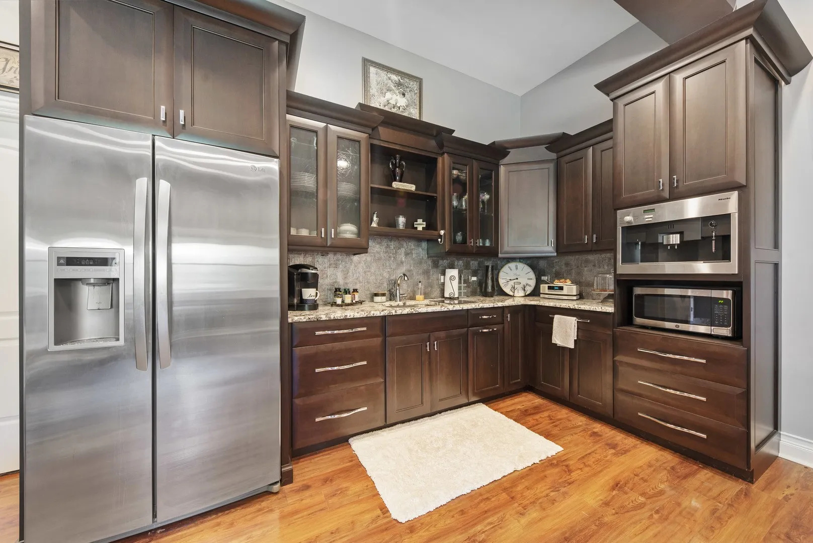 Undisclosed Address Manhattan, IL 60442 - Photo 5 of 9 a kitchen with a refrigerator and cabinets
