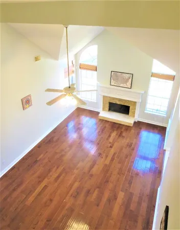 a view of a kitchen with a sink stove cabinets and a refrigerator