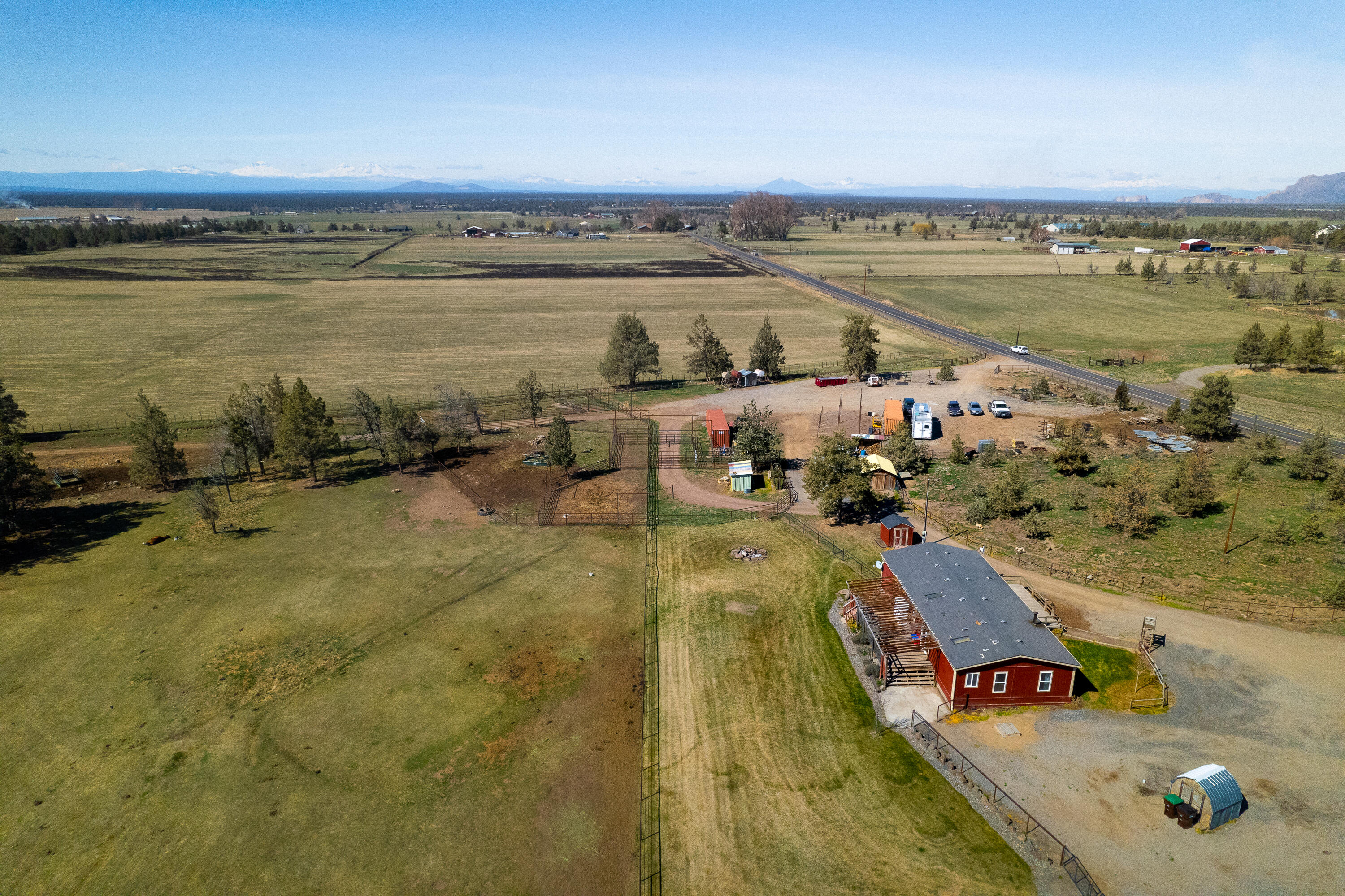 12106 Southwest Houston Lake Road Powell Butte, OR 97753 - Photo 6 of 51 Aerial shot of backyard and pasture behind home
