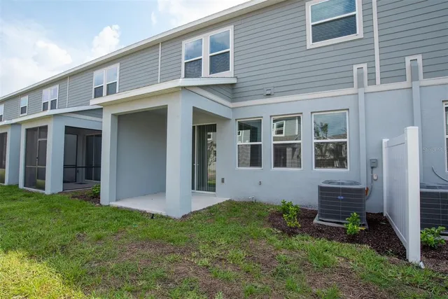 a view of an house with backyard space and a garden