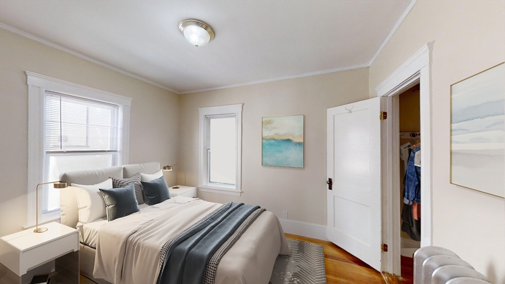 303 Tappan Street, Unit 3 Brookline, MA 02445 - Photo 6 of 10 a bedroom with a bed and a window