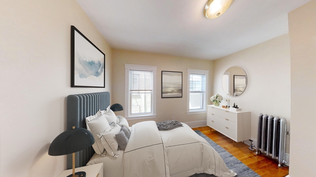 303 Tappan Street, Unit 3 Brookline, MA 02445 - Photo 8 of 10 a bed room with two beds and a window