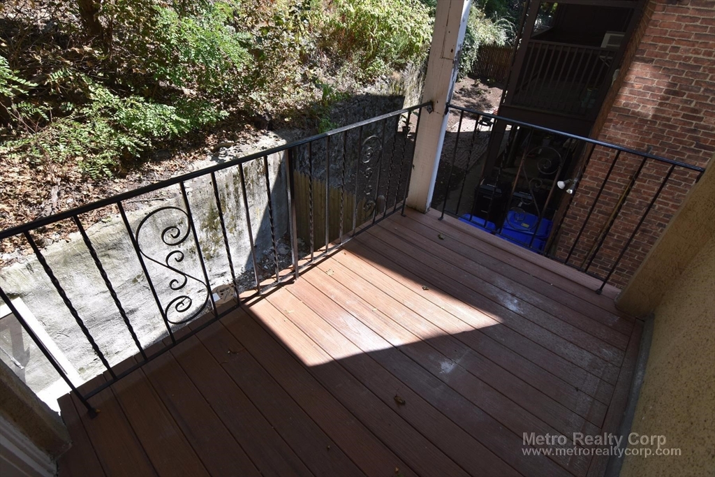 303 Tappan Street, Unit 3 Brookline, MA 02445 - Photo 10 of 10 a view of a wooden floor