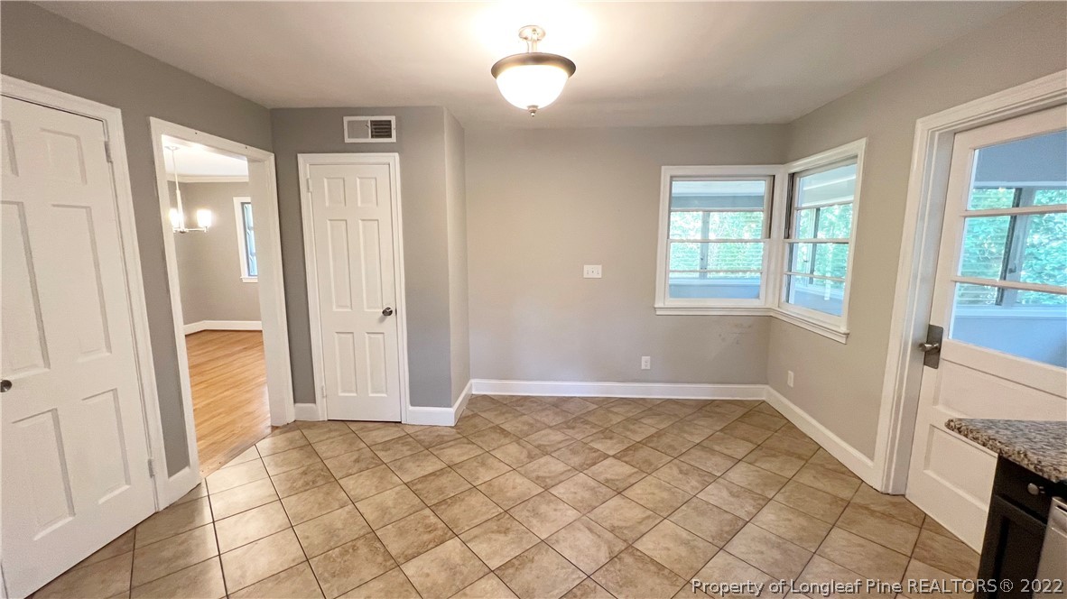 516 Valley Road Fayetteville, NC 28305 - Photo 11 of 48 an empty room with windows and closet