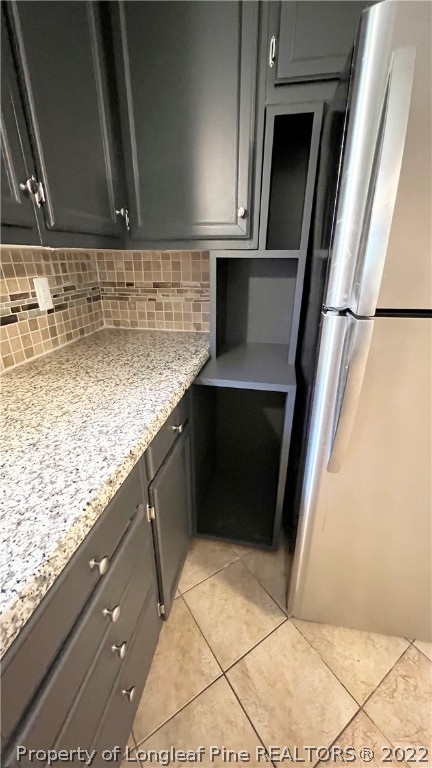 516 Valley Road Fayetteville, NC 28305 - Photo 15 of 48 a kitchen with a sink and a refrigerator