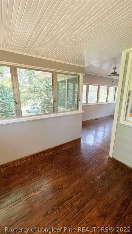 516 Valley Road Fayetteville, NC 28305 - Photo 21 of 48 an empty room with wooden floor and windows