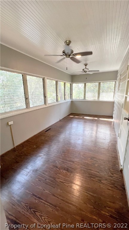 516 Valley Road Fayetteville, NC 28305 - Photo 23 of 48 an empty room with wooden floor and windows