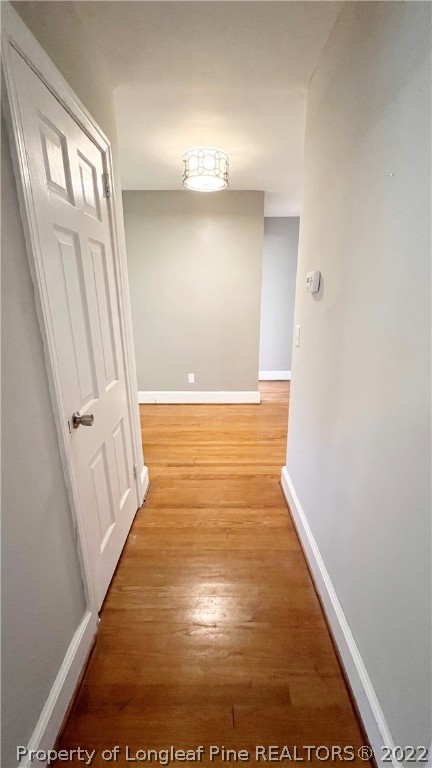 516 Valley Road Fayetteville, NC 28305 - Photo 27 of 48 view of an empty room with wooden floor and a window