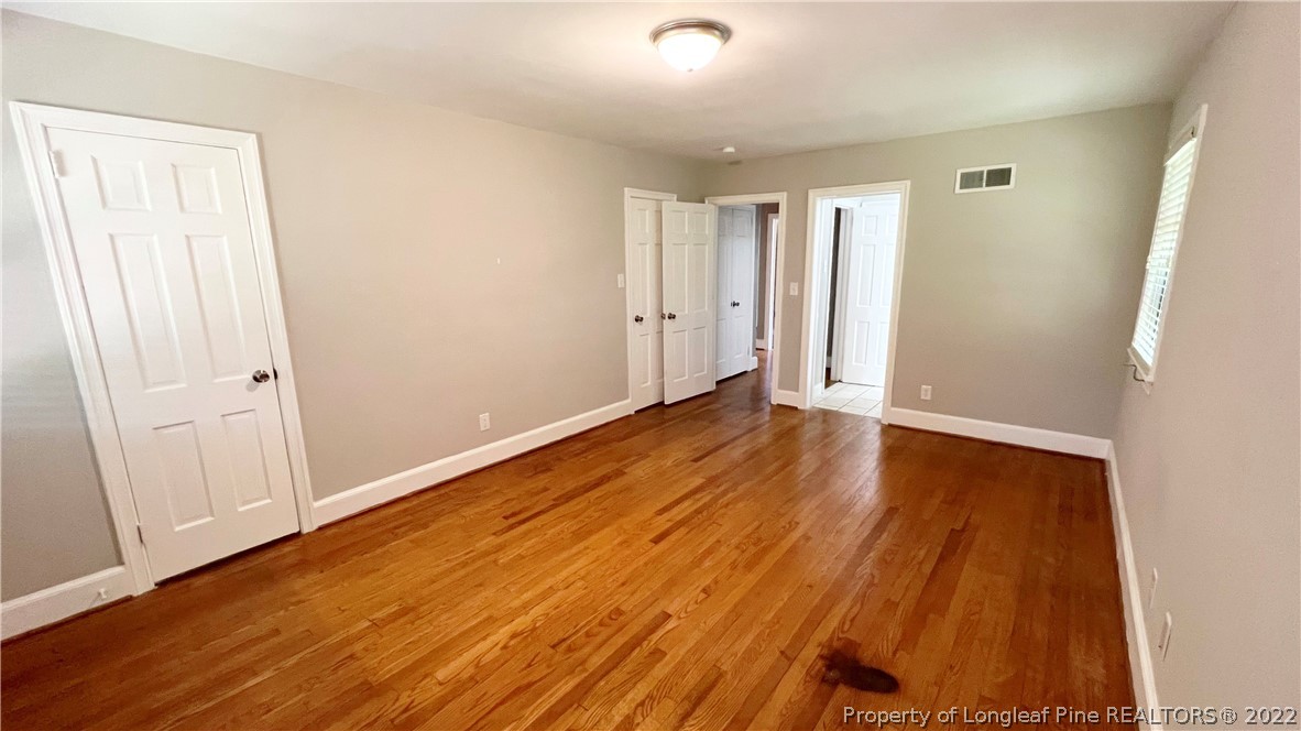 516 Valley Road Fayetteville, NC 28305 - Photo 37 of 48 a view of an empty room with wooden floor