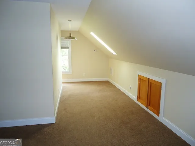 a view of a hallway with an empty room