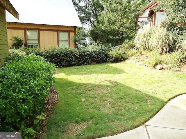 a view of a yard with an outdoor space