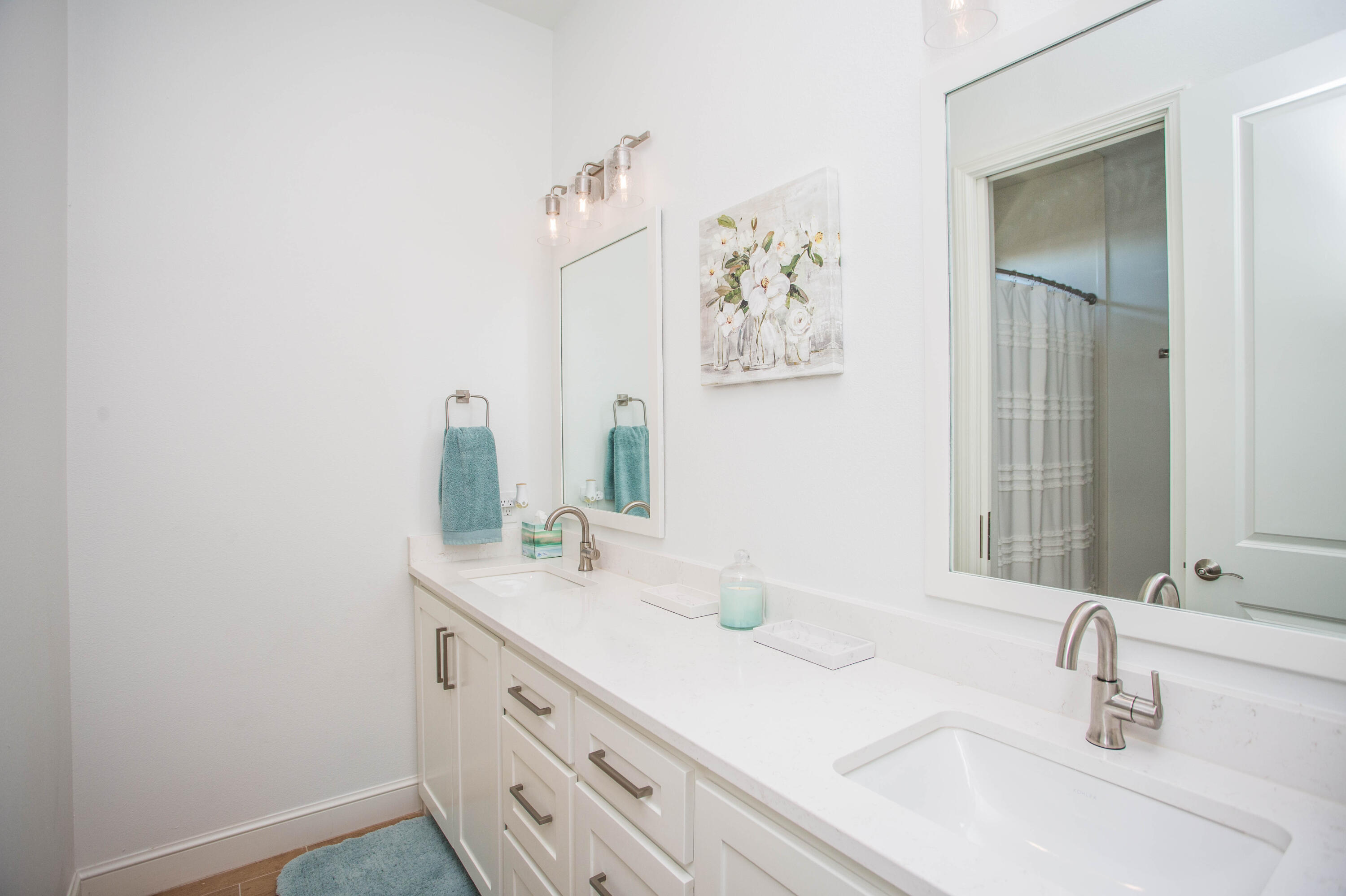 209 South Holliday Plainview, TX 79072 - Photo 14 of 29 a bathroom with a double vanity sink and a mirror