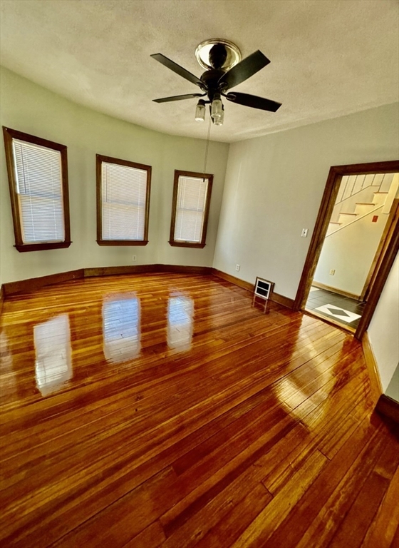 10 Clay Avenue Everett, MA 02149 - Photo 4 of 17 a view of a room with wooden floor