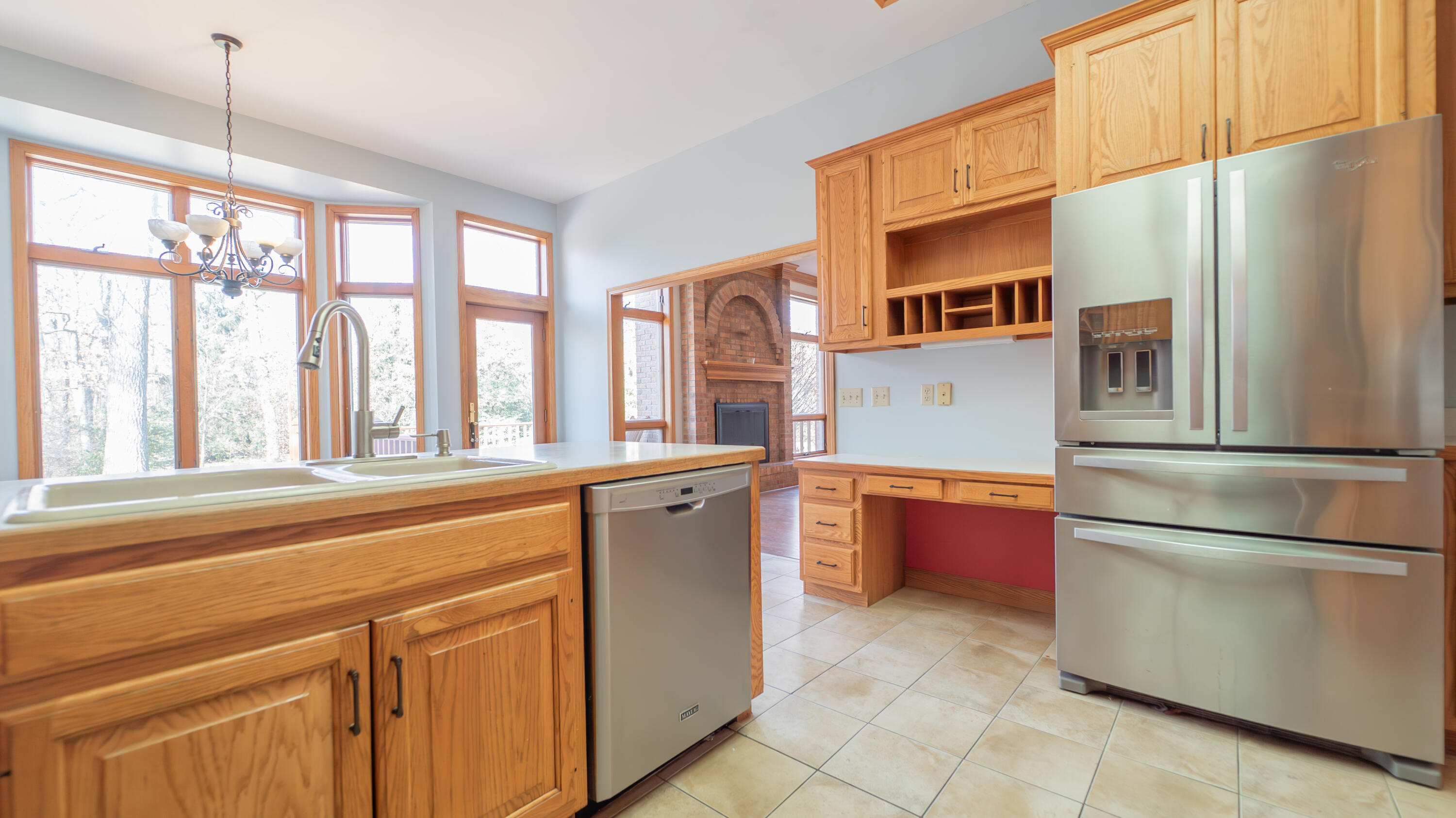 6614 Ridgeview Drive Demotte, IN 46310 - Photo 15 of 50 a kitchen with stainless steel appliances granite countertop a refrigerator and a sink