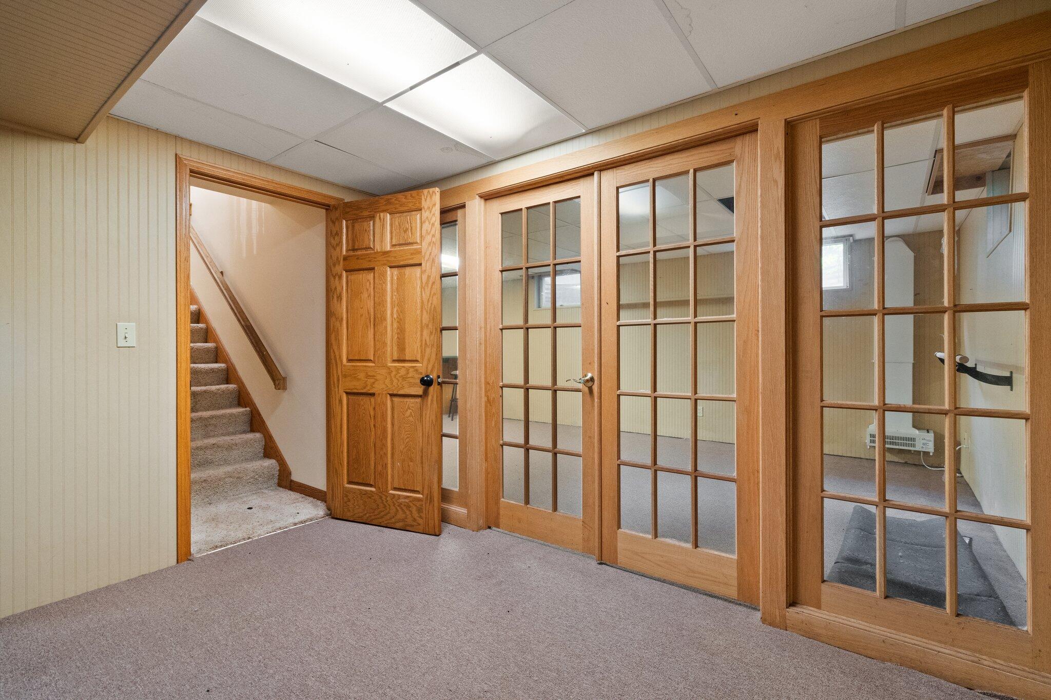 6614 Ridgeview Drive Demotte, IN 46310 - Photo 35 of 50 an entryway of a livingroom with wooden floor and stairs